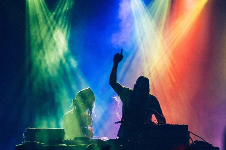 silhouette-of-dj-playing-with-colored-lights-.jpg