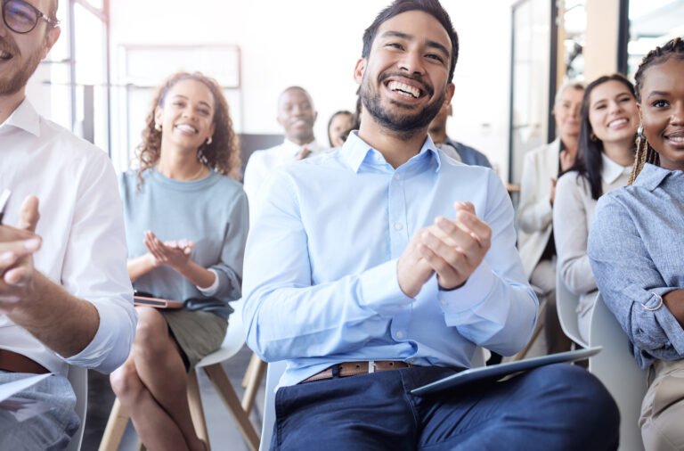 Cropped shot of a group of businesspeople applauding during a seminar in the conference room.