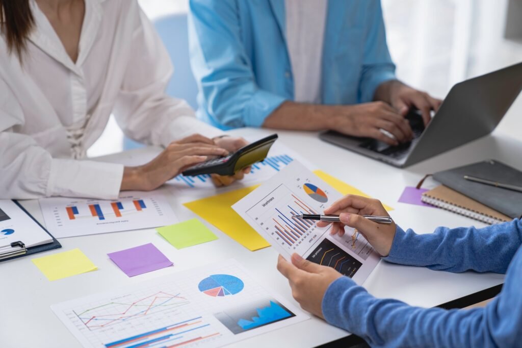marketing team meeting business people are meeting There are data sheets and charts on the table to